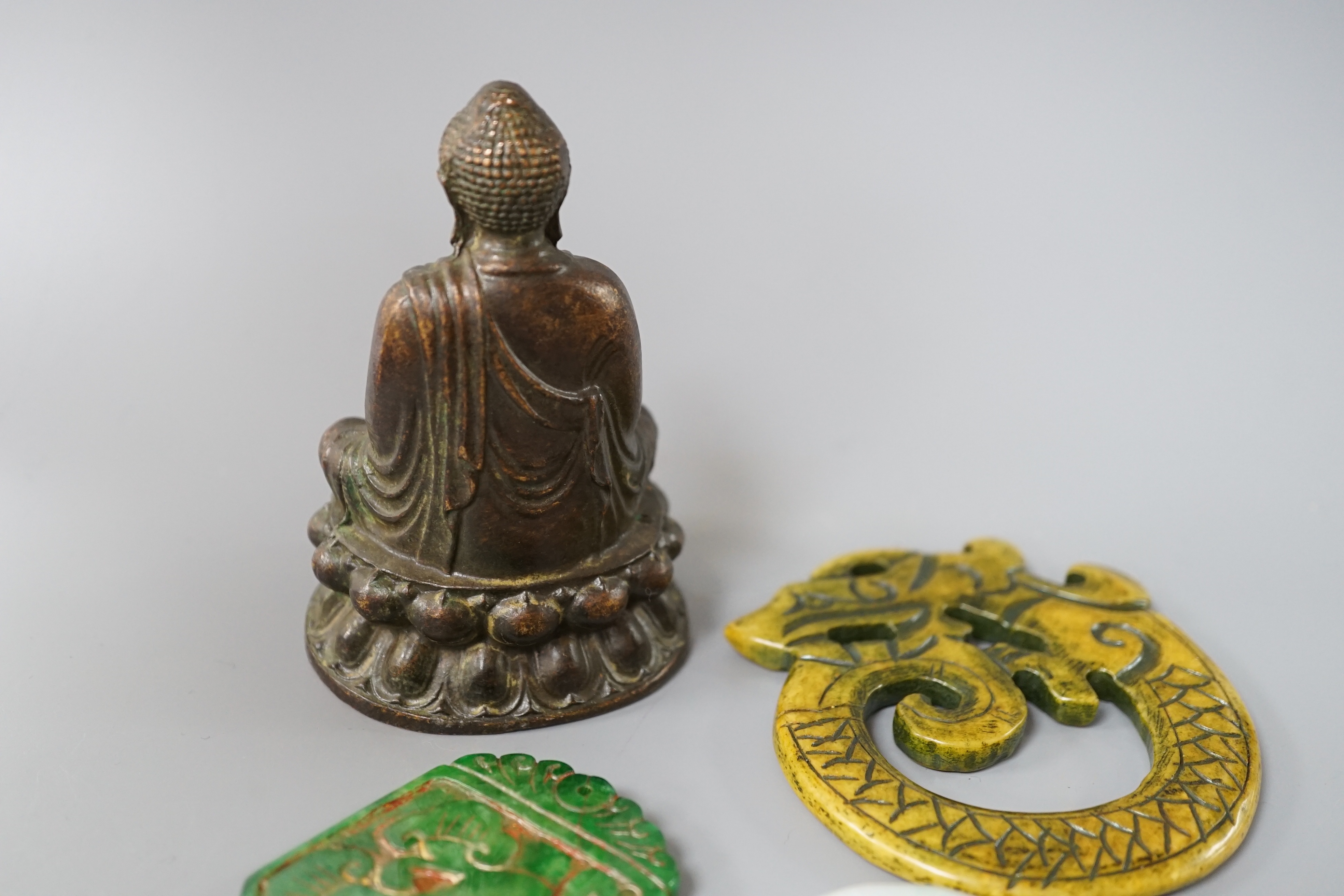Three Chinese hard stone carvings and a bronze Buddha, 9.5cm